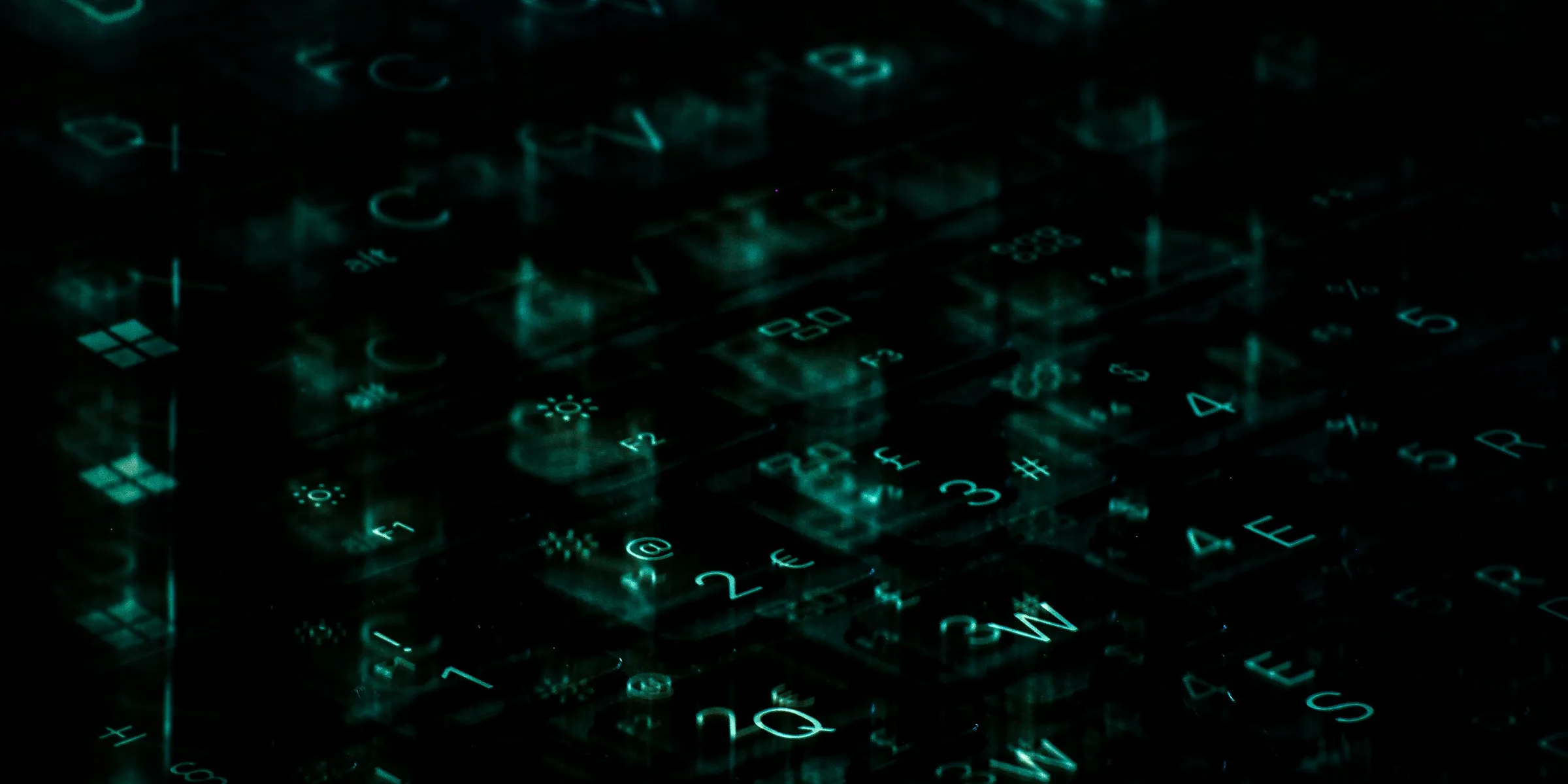 A computer keyboard with green light